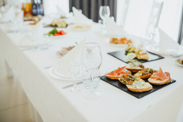 A beautifully arranged table with various gourmet snacks and drinks for guests