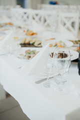 Elegant dining table set for a special event with gourmet cuisine and decor