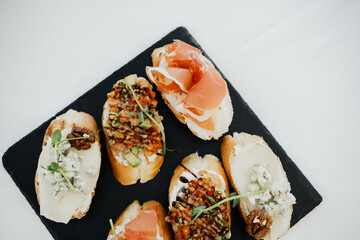 Delicious appetizers served on a slate platter at a casual gathering