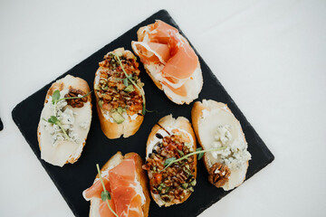 Gourmet appetizers on a serving platter at a social gathering