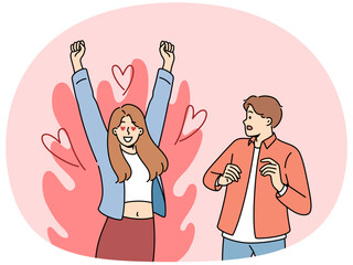 Excited woman is in love with man who is scared because of excessive passion from fan. Guy looks excitedly at girlfriend feeling great passion and sympathy for boyfriend or fiance.