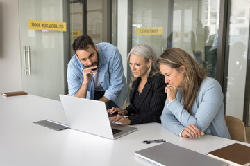 Engaged in brainstorming. Team three diverse businesspeople international company department staff...
