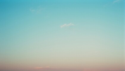 Fototapeta premium Azure Canvas: A serene expanse of pastel blue sky, brushed with delicate hints of color, provides a tranquil backdrop, perfect for evoking calmness.