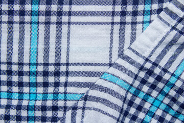 Classic blue and cyan plaid fabric texture as background