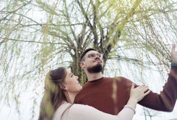 Fototapeta premium Romance outdoors dancing. Happy young couple dancing in stylish clothes. Romantic and spontaneous date moment