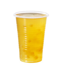 A refreshing drink in a clear glass with fruit cubes suspended in a cloudy but translucent drink creates a visually intriguing texture.