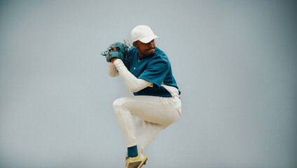 Dynamic baseball action as a skilled pitcher prepares to throw a powerful pitch