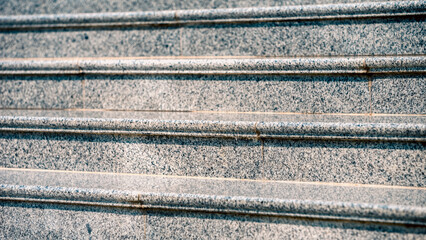 steps of an empty stone granite staircase close up