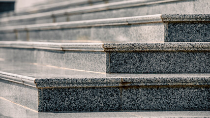 steps of an empty stone granite staircase close up