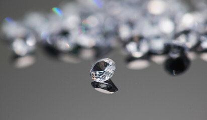 Gemstones, Diamonds over black background, crystals, beautiful brilliants sparkling with colorful caustics, rainbow lights. Moissanite. Zirconia. Gems 