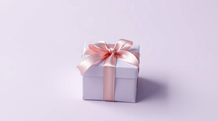 Obraz premium Small Gift Box with Ribbon on Pastel Lavender Background