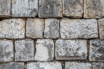 abstract background of an old stone wall close up