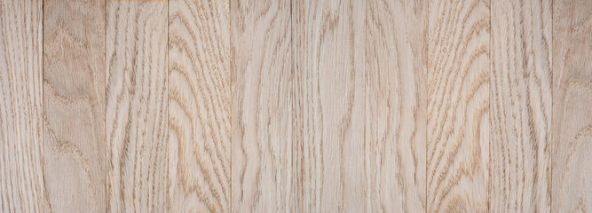 Light oak wooden planks with natural grain pattern. Seamless wooden surface texture background. Tot view.