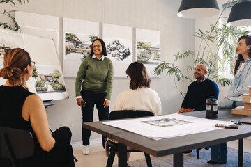 Team discussing project management plans in a modern office setting