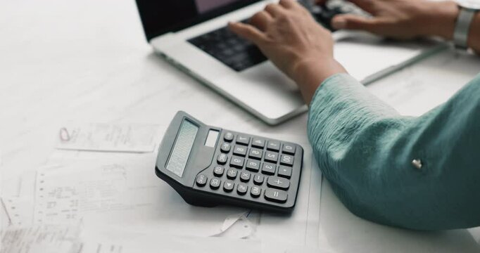Accountant woman planning corporate budget, calculating money, profit, expenses, doing accounting work, using calculator over paper bills, invoices. Cropped shot of hands, top view