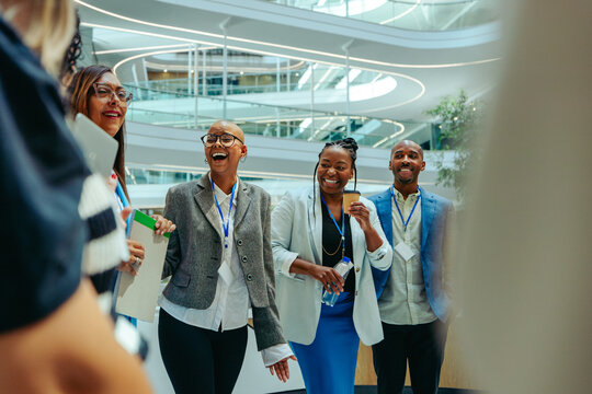 Group of colleagues networking at a banking conference and building professional connections