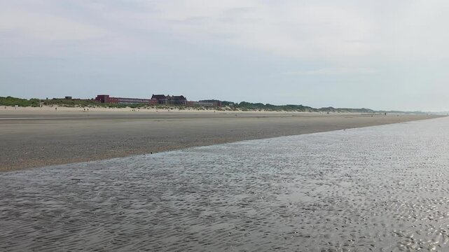 North sea beach near Dunkirk, France, on a sumer day with low tide, almost empty
