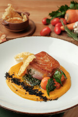 Smoked Gindara Fillet with Citrus Dressing, Carrot Purée, Crunchy Fennel and Herbs – Gourmet Fine Dining Fish Dish on Elegant Plate
