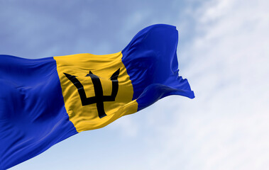 Barbados national flag with Broken Trident waving in sky. 3D render
