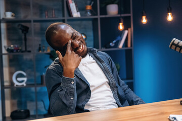 Black man is doing podcast in the studio