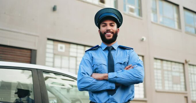 Arms crossed, crime and face of man police officer outdoor in city for patrol or security. Confident, safety and smile with happy cop person downtown in guard uniform for protection or trust