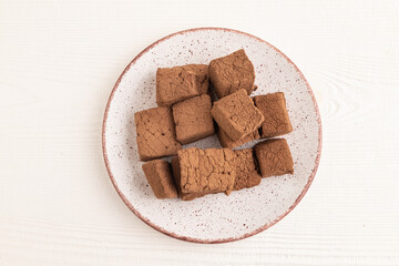 Chocolate marshmallow on white wooden. top view