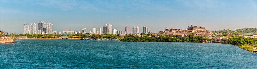 Naklejka premium A panorama view across an inner waterway towards the Fort of San Felipe in Cartagena, Columbia in springtime 