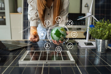 Businesswoman using computer on CO2 emission reduction concept with global warming icon. along with...