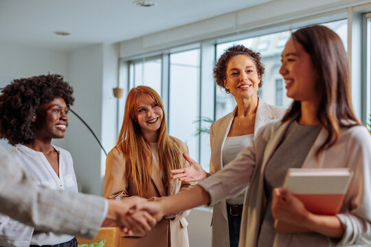 Excited new intern meeting her colleagues