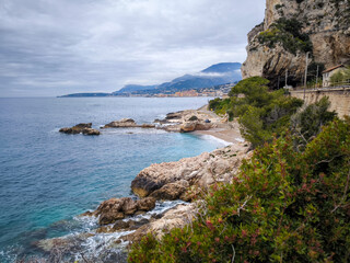 Rocky Balzi Rossi Beach in Liguria, Italy: A Stunning Coastal View Near Menton Overlooking the Tranquil Blue Sea