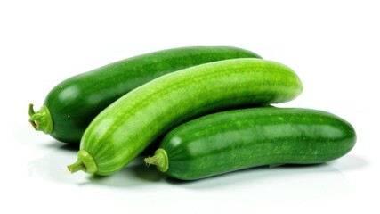 vibrant green cucumbers placed on white background. fresh vegetables showcasing healthy eating and natural ingredients. food photography, culinary blogs, wellness content.