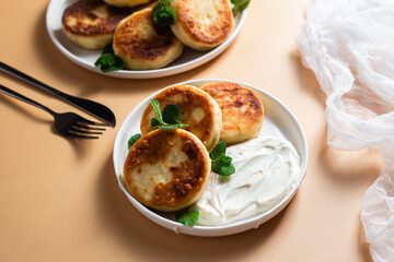 Homemade cottage cheese pancakes with sauce 