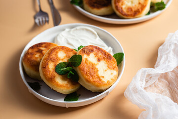 Homemade cottage cheese pancakes with sauce 