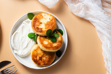 Homemade cottage cheese pancakes with sauce 