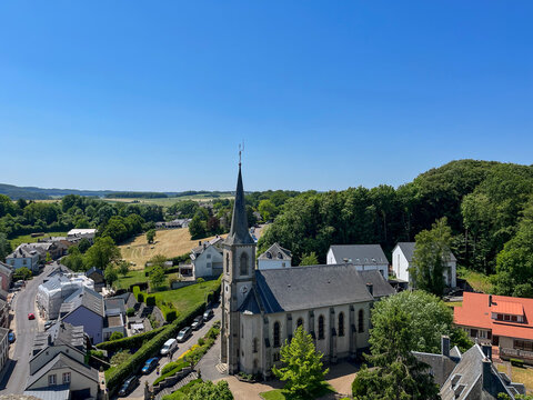 Part of the village of Useldange and St Peter's church from above. Useldange, Luxembourg.