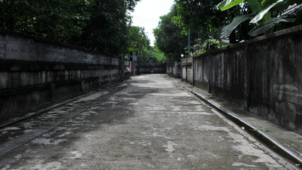 Fototapeta premium View of a long dark alley