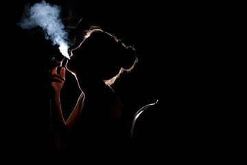 silhouette of a woman in a smoke