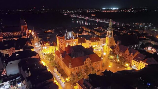 Night aerial view of the old town in Toruń, Poland.