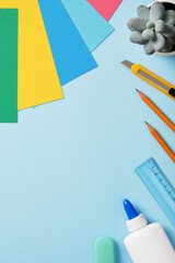 Supplies for paper art hobby: craft knife, pencil, eraser, glue, ruler, colored paper. Space for...