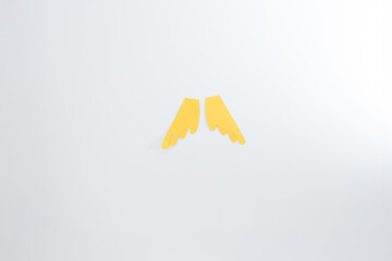 two yellow paper wings cut outs, step in creative project a creative bird puppet made from everyday...