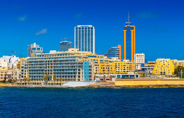 Cityscape of Saint Julian's with modern hotel buildings and skyscrapers viewed from the Sea, Malta