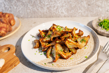 Fried Jerusalem artichoke wedges with a sprinkle of herbs.