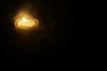 Illuminated Candle in Darkness, Symbolizing Hope, Solitude, and Serenity