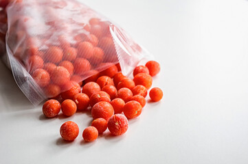 Frozen Cherry Tomatoes in Plastic Storage Bag. Copy space.