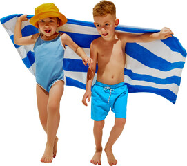 Little children, excited boy and girl in swimwear running with towel as they run from water on...
