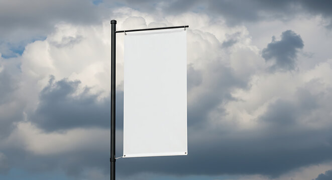 Blank banner on pole against cloudy sky