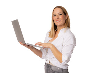 Image of cheerful young woman standing isolated over transparent background using laptop computer. Looking camera.