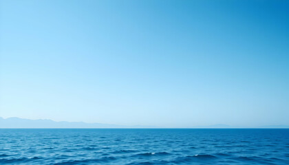 Fototapeta premium Serene Blue Ocean Distant Mountainscape Calm Water Summer Sky