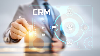 CRM Customer relationship management concept. Businessman pressing button on screen.