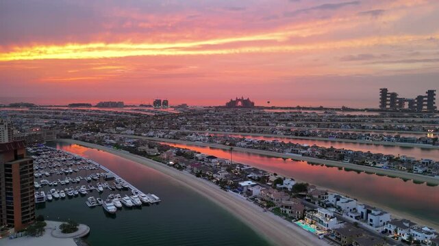 Dubai, UAE: Aerial view of capital city of Emirate of Dubai, artificial islands beach district of Palm Jumeirah - landscape panorama of Arabian Peninsula from above
